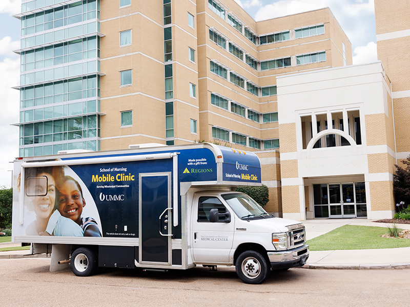 The UMMC School of Nursing mobile clinic outside the School of Nursing building